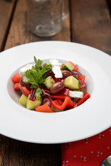 Salad with cheese, cucumber, red pepper and olives