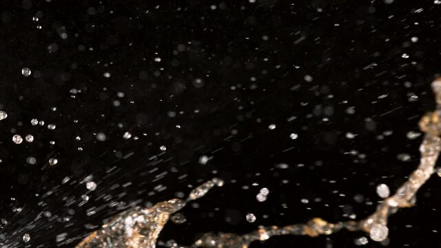 Super slow motion of cola splashes on black background. Filmed on high speed cinema camera, 1000 fps