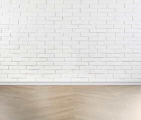 Wooden floor and white brick wall indoors