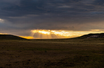 Naklejka na ściany i meble A Beautiful Sunset on the Prairie after a Summer Storm