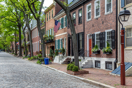 Philadelphia street scene in historical Society Hill section of the city.  Showing colonial homes on a cobblestone street.