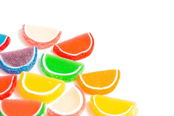 Fototapeta na wymiar A Variety of Multicolored Candy Fruit Slice on a White Background
