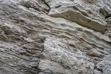 Rock textured stone. Cross bedded sandstone or gypsum with lots of layers