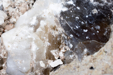 Mineral inside of stone. Unpolished quartz excavating or deposit. Semi-precious gems mining