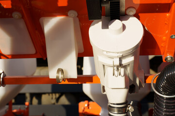 Close-up of agricultural seeder mechanisms.