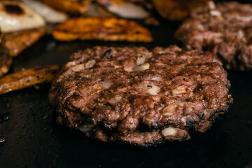 steel grilled meat burger with wood flame fries in metallic foil herbs oregano cordoba argentina