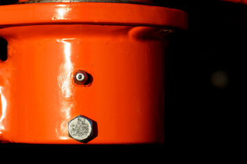 Close up of grease nipple and bolt of agricultural seeder.