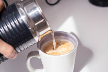 close-up coffee with milk from the machine with foam cordoba argentina
