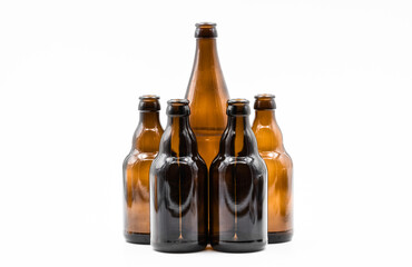 A row of empty brown bottles