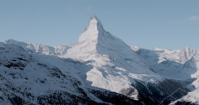 Hiking path in front of the Matterhorn  in the morning light in winter. Video taken from the hiking trail from Blauherd to Fluhalp, above Zermatt in Valais, Switzerland.