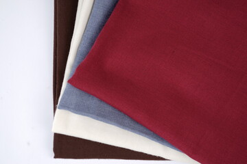 The veil is red, white, gray and brown. Neat combination of several colorful fabrics. Thin fabric texture is commonly used for fashion materials. Fabric mockup for a design template. Blank veil fabric