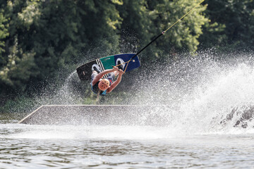 Prague, Czech Republic - August 7, 2018: man board surfing on lake