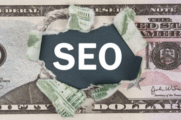 The dollar is torn in the center. In the center it is written - SEO