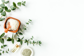 Eucalyptus essential oil, eucalyptus leaves on white background. Natural, Organic cosmetics products. Medicinal plant. Natural Serums. Flat lay, top view.