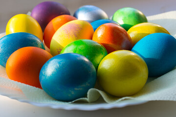 Fototapeta na wymiar Chicken eggs are painted in bright colors. Feast of Holy Easter