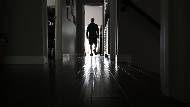 Man walking to French doors low angle interior.