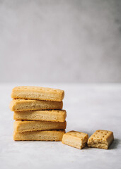 pile of shortbread cookies on a grey background