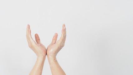 Washing hand gusture and soap foam  wipe on hand for prevention and hygiene on white background.