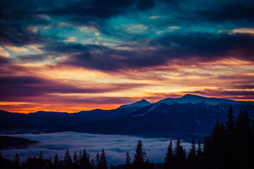 Beautiful dawn in the winter snow-covered mountains