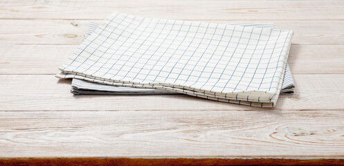 Kitchen towel, napkin on wooden desk. Top view mockup
