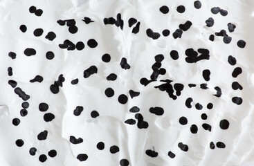 Texture airy foam white background with black drops
