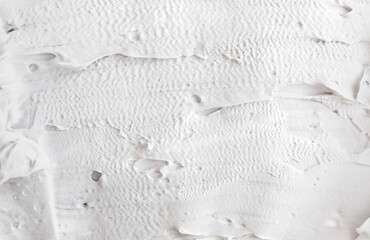 White abstract texture of surface with bold rough putty