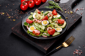 Salad with shrimp, avocado, cucumber, pumpkin seeds and flax seeds with olive oil