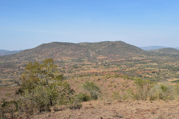 Fototapeta na wymiar Scenic arid landscapes against sky in rural Kenya