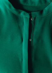 Close up of a green satin shirt