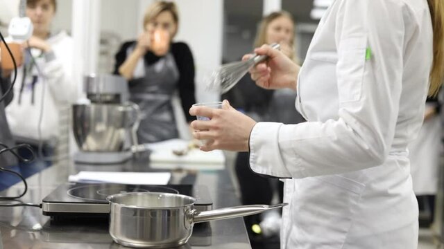 Ukraine, Dnipro. December 2019. Confectionery master class. Confectioner works as a mixer