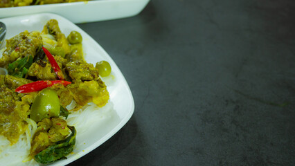 Green curry with beef. Famous food in Thailand. The food consists of curry paste. Blended with herbs Simmered with coconut milk And meat Season with fish sauce and sugar,add brinjal and sweet eggplant