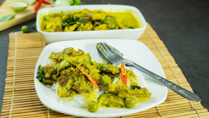 Green curry with beef. Famous food in Thailand. The food consists of curry paste. Blended with herbs Simmered with coconut milk And meat Season with fish sauce and sugar,add brinjal and sweet eggplant