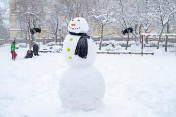Snowman in the park during historical Snowtorm over Madrid city, Spain.
