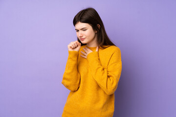 Young Ukrainian teenager girl over isolated purple background is suffering with cough and feeling bad