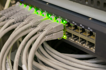 A bunch of internet wires are connected to the server switch. There are many subscriber Internet...
