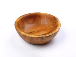 Bowl made of wood. Household kitchen utensils of walnut wood for dining