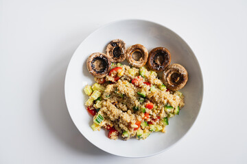 Quinoa salad with vegetables and grilled mushrooms
