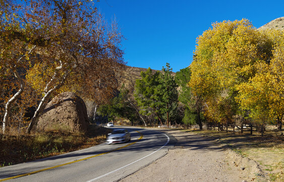 Long exposure image taken along Bouquet Canyon Road north of Santa Clarita, California. The blurring of the moving car was achieved by using a ND filter to increase the exposure time.