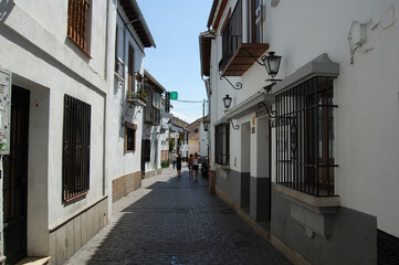 View of the streets and old buildings of Granada, historic city of Andalusia (Spain). 