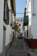 View of the streets and old buildings of Granada, historic city of Andalusia (Spain). 