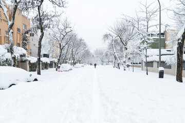 People enjoying the historical Snowtorm over Madrid city, Spain.