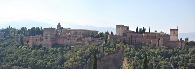 Fototapeta premium View of the streets and old buildings of Granada, historic city of Andalusia (Spain). The Alhambra from the viewerpoint of San Nicolas.