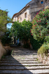 Travel destination, small ancient village Cotignac in Provence, surrounded by vineyards and cliffs with troglodytes houses.