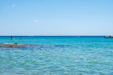 Fototapeta premium Summer vacation on French Riviera, crystal clear azure blue water of Mediterranean sea in Saint Clair near Le Lavandou, Var, Provence, France