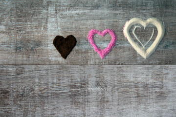 different color hearts shapes on wood table