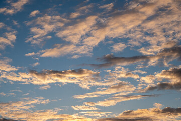 sky with clouds reflecting the pink sun