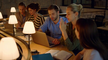 Business people working with laptops in office. Colleagues analyzing data