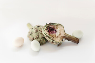 fresh artichokes on white background