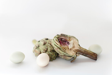 fresh artichokes on white background