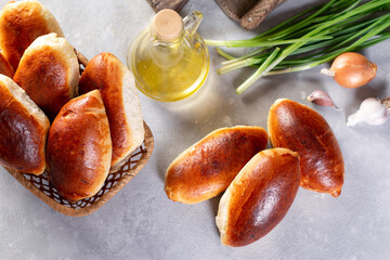 Russian pastries (pirogi) filled with eggs and green onion, closeup